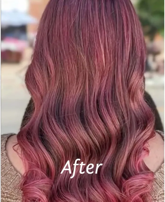Person with long, wavy hair dyed in shades of pink and purple, shown from the back. The word "After" is written over the image. Copperfalls Aveda Spa & Salon, Castle Rock, CO